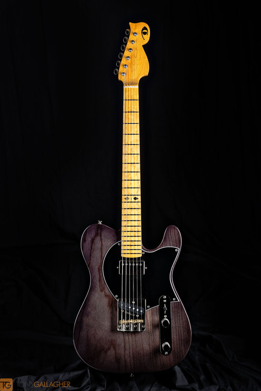 Torrelli 0722.  Swampash slab body.  Maple neck and FB.  Trans black nitro finish.  